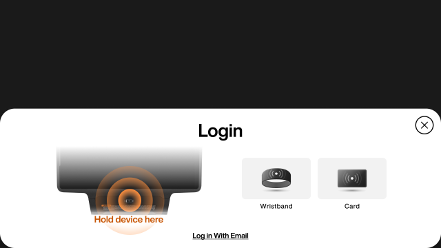 Login screen displaying options for wristband or card, with a highlighted area to scan on the machine